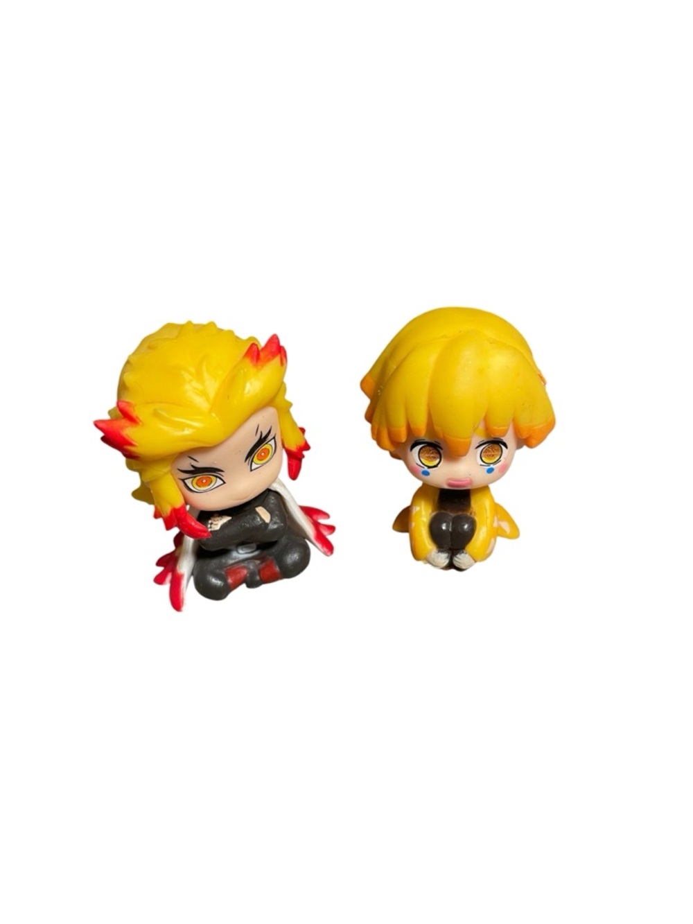 miniature figurines of Kyōjurō Rengoku and Zenitsu Agatsuma